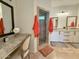 Elegant main bathroom with a walk-in shower, granite countertops, and ample vanity space at 3811 N 64Th St, Scottsdale, AZ 85251
