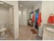 Spacious main bathroom featuring tiled floors, a vanity area, and a walk-in shower with glass door at 3811 N 64Th St, Scottsdale, AZ 85251