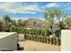Scenic view from the home showcasing lush greenery, mature trees, and Camelback Mountain in the distance at 3811 N 64Th St, Scottsdale, AZ 85251