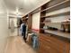 Spacious walk-in closet with custom shelving and hanging racks for optimal organization and storage solutions at 3811 N 64Th St, Scottsdale, AZ 85251