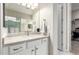 Bright bathroom features a marble countertop, white cabinets, and a walk-in closet at 4086 E Narrowleaf Dr, Gilbert, AZ 85298