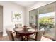 Cozy dining area with access to the backyard patio through sliding glass doors at 4086 E Narrowleaf Dr, Gilbert, AZ 85298