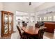Inviting dining area with wood table and chairs, open to the kitchen and living areas at 4086 E Narrowleaf Dr, Gilbert, AZ 85298