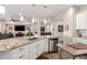 Open kitchen island with stainless steel sink and dishwasher with views to other living areas at 4086 E Narrowleaf Dr, Gilbert, AZ 85298