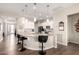 Bright kitchen features a large island with bar seating and pendant lighting at 4086 E Narrowleaf Dr, Gilbert, AZ 85298