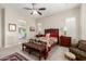 The main bedroom has a view of the en-suite bathroom and a large sitting area at 4086 E Narrowleaf Dr, Gilbert, AZ 85298