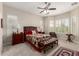 The main bedroom is spacious and filled with natural light with neutral carpeted floors at 4086 E Narrowleaf Dr, Gilbert, AZ 85298