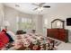 The main bedroom is spacious and bright with shutters and a sitting area at 4086 E Narrowleaf Dr, Gilbert, AZ 85298