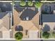 Aerial view of the property showing the roof, landscaping, driveway, and surrounding neighborhood at 445 S Omaha --, Mesa, AZ 85206