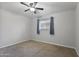 Bedroom featuring a ceiling fan, light walls, and bright picture window at 445 S Omaha --, Mesa, AZ 85206