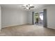 Expansive bedroom featuring a ceiling fan and access to a large private backyard at 445 S Omaha --, Mesa, AZ 85206