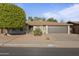 Charming single-story home with a well-maintained desert landscape and an attached two-car garage at 445 S Omaha --, Mesa, AZ 85206