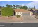 Charming single-story home with a two-car garage, manicured lawn, and mature trees at 445 S Omaha --, Mesa, AZ 85206