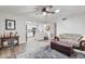Inviting living room with a ceiling fan, adjacent to the modern kitchen at 445 S Omaha --, Mesa, AZ 85206