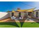 Inviting backyard featuring lush turf grass, shaded patio area, and stylish outdoor furniture for relaxing at 4539 N 9Th Ave, Phoenix, AZ 85013