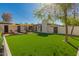 Sprawling backyard with lush turf and a stylish patio area with shade awning that are perfect for entertaining guests at 4539 N 9Th Ave, Phoenix, AZ 85013