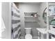 Clean bathroom featuring gray tile, open shelves, and modern fixtures at 4539 N 9Th Ave, Phoenix, AZ 85013