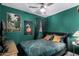 Inviting bedroom with green walls, leaf pattern bedding, and tasteful decor at 4539 N 9Th Ave, Phoenix, AZ 85013
