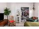 Well-lit bedroom featuring a decorated rocking chair and an organized walk-in closet at 4539 N 9Th Ave, Phoenix, AZ 85013
