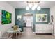 Inviting dining area with modern lighting, artwork, and a view into the kitchen at 4539 N 9Th Ave, Phoenix, AZ 85013