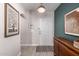 Inviting foyer with elegant artwork, stylish light fixture, and modern wood sideboard at 4539 N 9Th Ave, Phoenix, AZ 85013