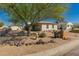 Quaint single-story home landscaped with cacti, trees, decorative rocks, and a vibrant blue sky at 4539 N 9Th Ave, Phoenix, AZ 85013