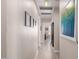 Bright hallway with sleek, modern design, art, and doorways leading to various rooms at 4539 N 9Th Ave, Phoenix, AZ 85013