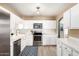 Well-appointed kitchen with stainless steel appliances, white cabinets, and modern fixtures at 4539 N 9Th Ave, Phoenix, AZ 85013