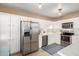 Updated kitchen featuring white cabinets, stainless steel appliances, and a stylish blue patterned rug at 4539 N 9Th Ave, Phoenix, AZ 85013