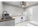 Efficient kitchen boasts updated appliances, tiled backsplash, and neutral color palette at 4539 N 9Th Ave, Phoenix, AZ 85013