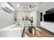 Bright living room with white sectional sofa, modern décor, and stylish wood flooring at 4539 N 9Th Ave, Phoenix, AZ 85013