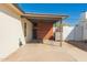 View of a spacious carport with wood accents, adjacent to a white brick building at 4539 N 9Th Ave, Phoenix, AZ 85013