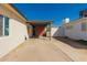 Covered parking area featuring a concrete floor and wood accent wall at 4539 N 9Th Ave, Phoenix, AZ 85013