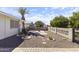 Private backyard boasts low-maintenance desert landscaping with mature trees, and a block fence at 5142 E Edgewood Cir, Mesa, AZ 85206