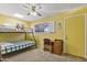 Brightly painted bedroom with a bunk bed, desk and a ceiling fan for added comfort at 5142 E Edgewood Cir, Mesa, AZ 85206
