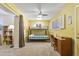Bright bedroom with a bunk bed, desk, and a ceiling fan, perfect for a room at 5142 E Edgewood Cir, Mesa, AZ 85206