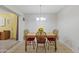 Traditional dining area with wooden table, upholstered chairs and neutral decor at 5142 E Edgewood Cir, Mesa, AZ 85206