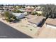 Aerial view of a well-kept house with desert landscaping and a circular driveway in a mature neighborhood at 5142 E Edgewood Cir, Mesa, AZ 85206