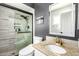 Modern bathroom featuring a glass-enclosed shower, granite vanity, and sleek fixtures for a spa-like experience at 519 W Palomino Dr, Chandler, AZ 85225