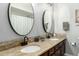 Elegant bathroom featuring dual sinks, granite countertops, and modern fixtures for a luxurious experience at 519 W Palomino Dr, Chandler, AZ 85225