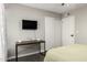 Inviting bedroom offers a built-in desk and lots of natural light creating a multifunctional and comfortable space at 519 W Palomino Dr, Chandler, AZ 85225