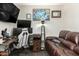 This bedroom has all you need with desk, monitors, couch, certificate and natural light at 519 W Palomino Dr, Chandler, AZ 85225