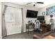 This is a bedroom complete with a desk, monitors, couch and natural light at 519 W Palomino Dr, Chandler, AZ 85225