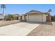 Well-maintained home with desert landscaping, wide driveway, and two-car garage at 519 W Palomino Dr, Chandler, AZ 85225