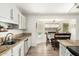 Kitchen area with granite countertops and view to eat-in dining space at 519 W Palomino Dr, Chandler, AZ 85225