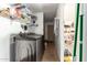 Functional laundry area with ample storage shelving for organization and efficiency at 519 W Palomino Dr, Chandler, AZ 85225
