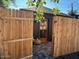 Charming backyard entrance with a wooden gate leading to a cozy outdoor space at 521 W Cambridge Ave, Phoenix, AZ 85003