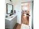 Bathroom featuring a modern vanity with bronze fixtures and view into connecting room at 521 W Cambridge Ave, Phoenix, AZ 85003