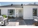 Exterior view of a charming home with a well-maintained front yard and attractive landscaping at 521 W Cambridge Ave, Phoenix, AZ 85003