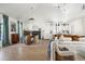 Bright open-concept living room featuring a modern kitchen, dining area, and comfortable seating at 521 W Cambridge Ave, Phoenix, AZ 85003